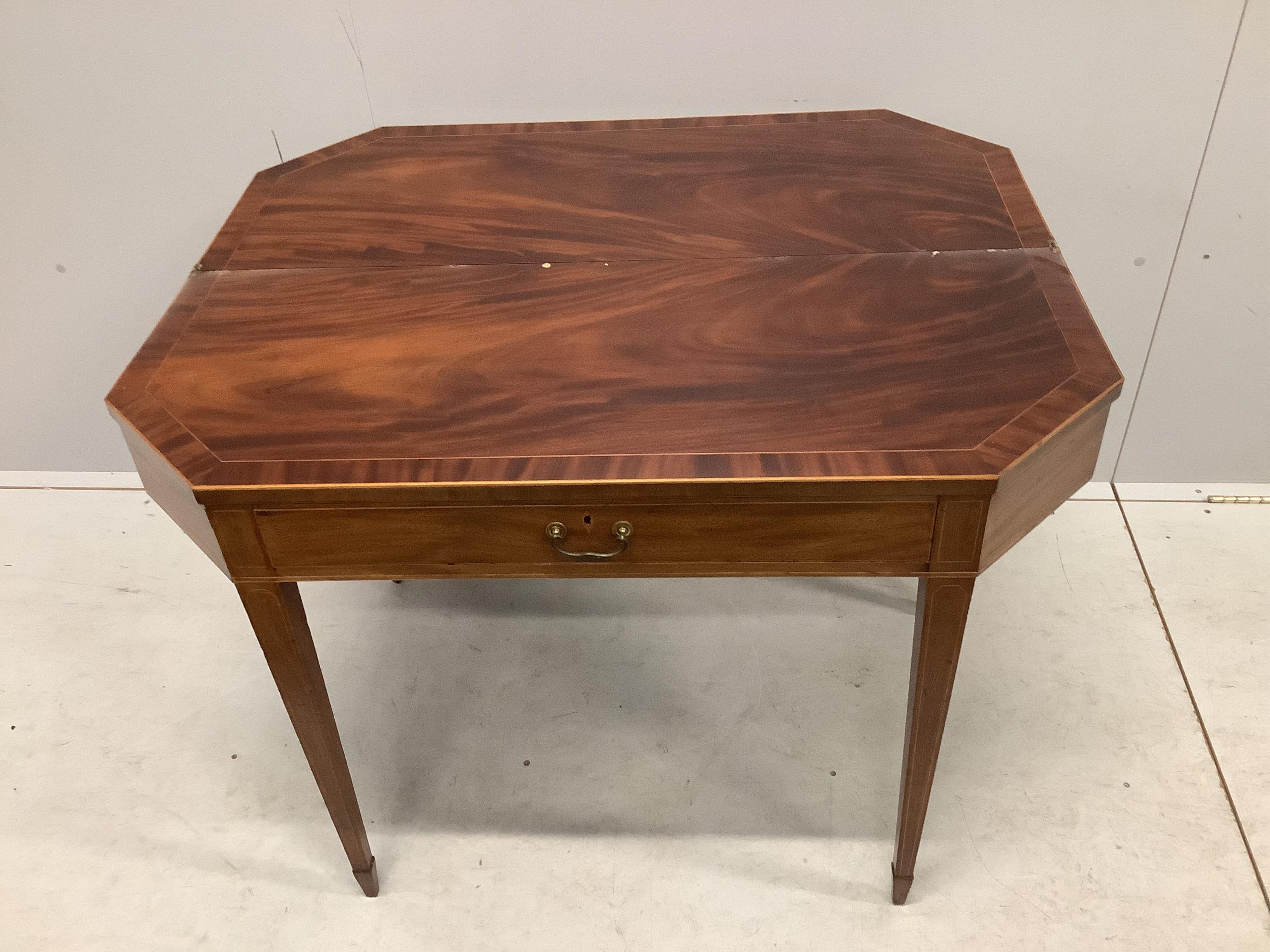 A George III mahogany folding tea table with frieze drawer, width 101cm, depth 41cm, height 73cm. Condition - fair to good